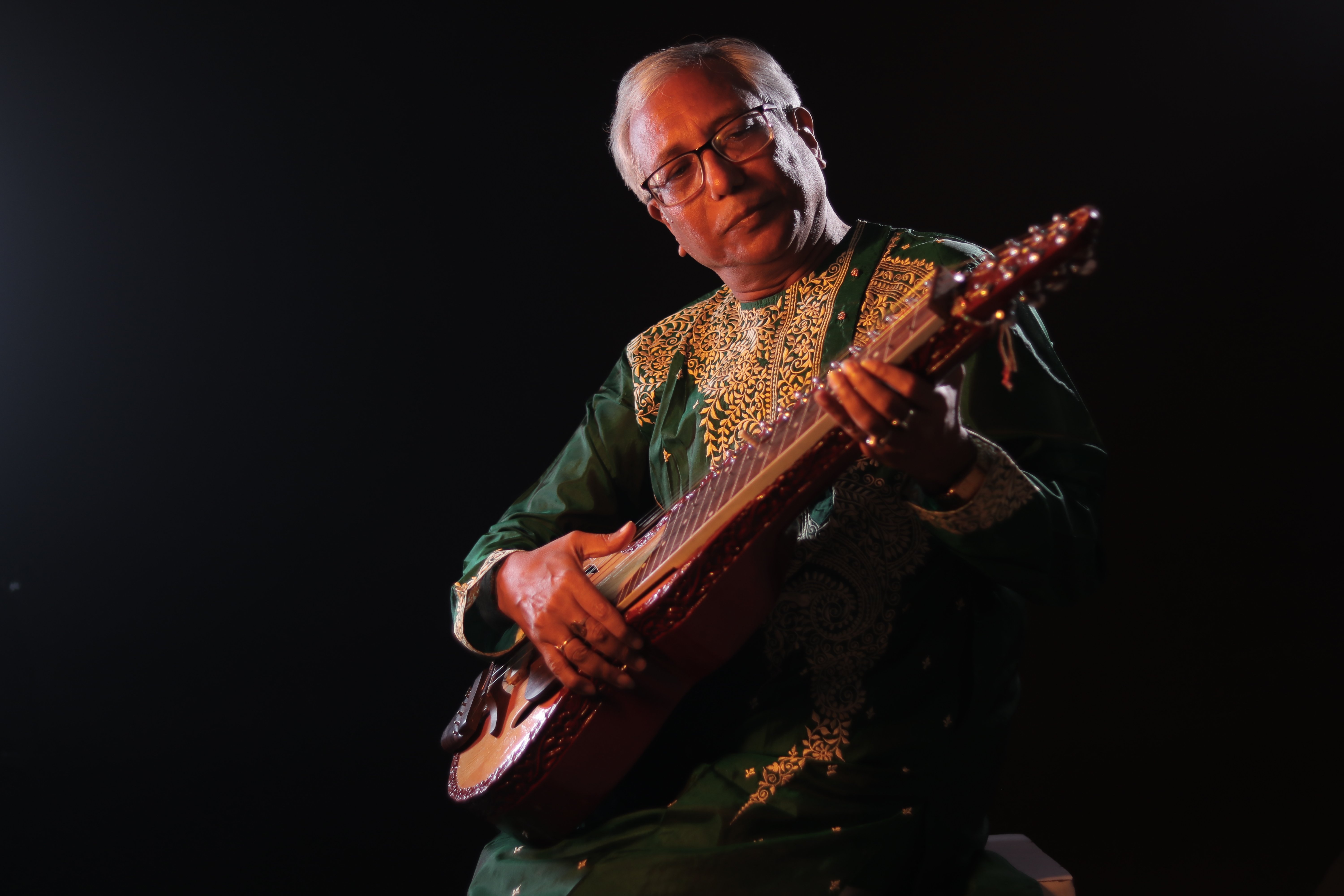 Pandit Debasis Chakroborty playing Indian slide guitar